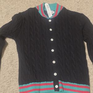 Black Cable Knit Sweater with Red and Green Accents